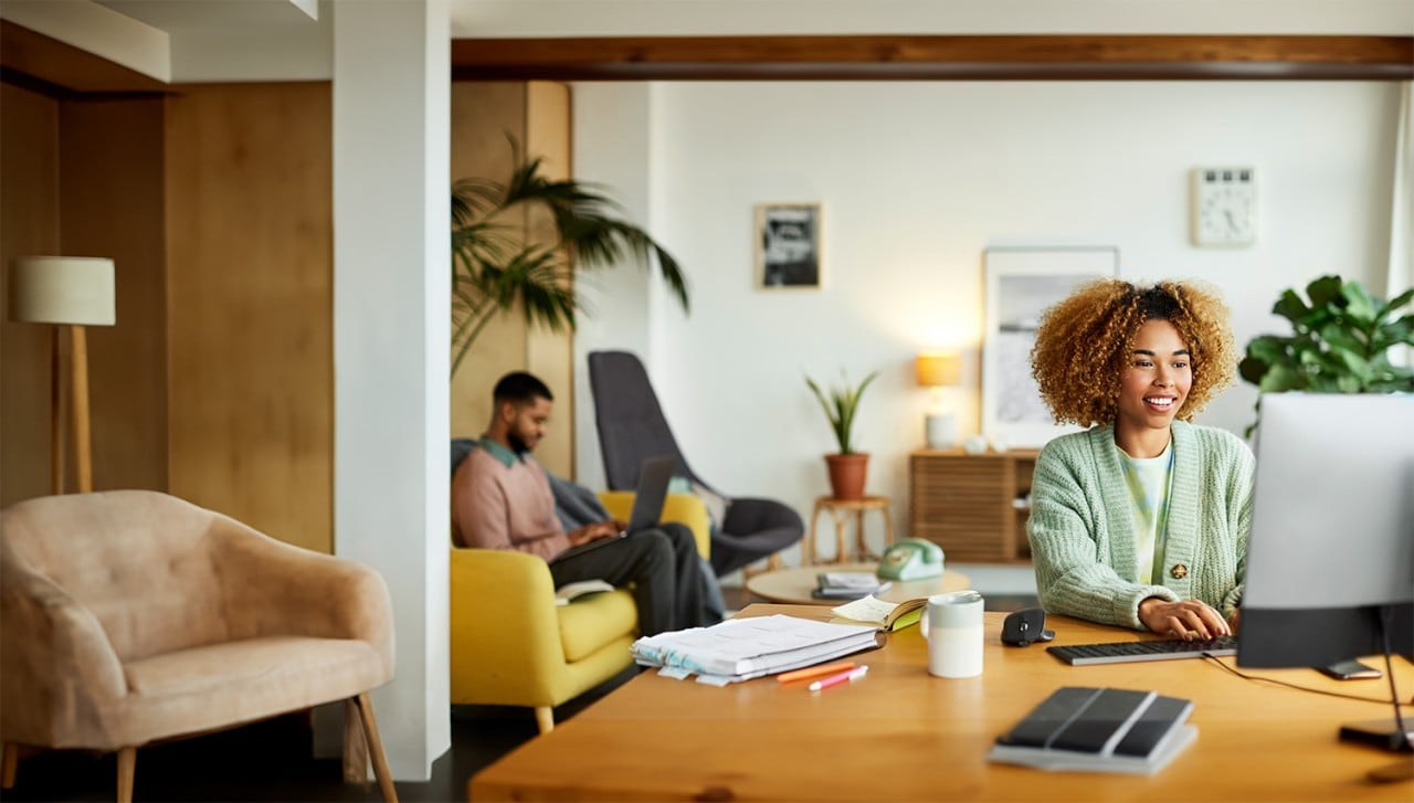 Young African American Businesswoman Looking at Computer