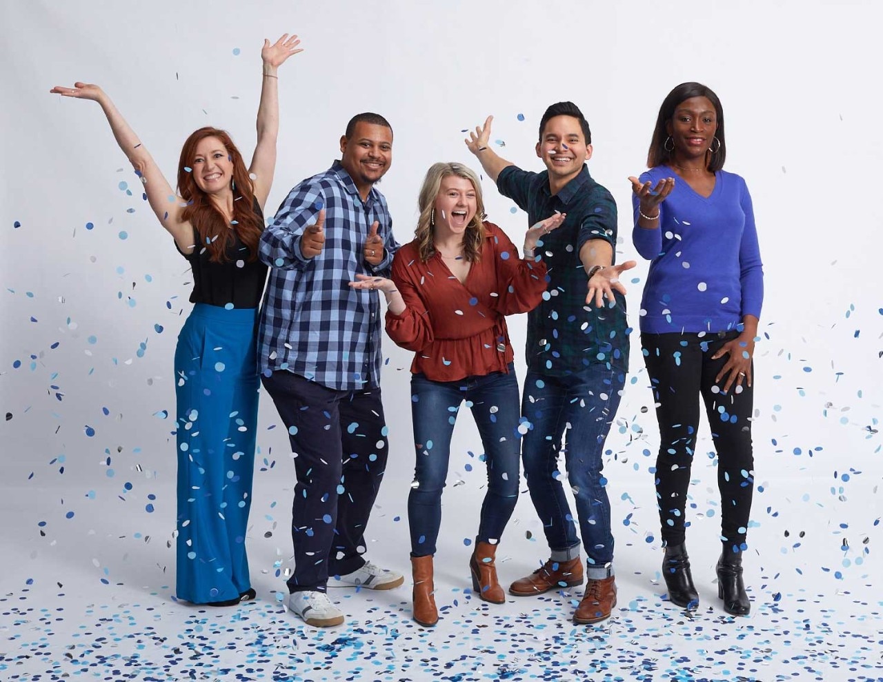 SAS employees with confetti on white background