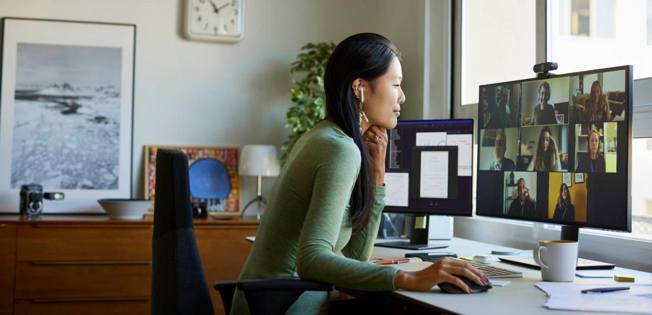 Woman using earbuds on video conference