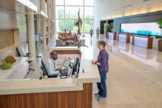 Employees at SAS Building C reception desk