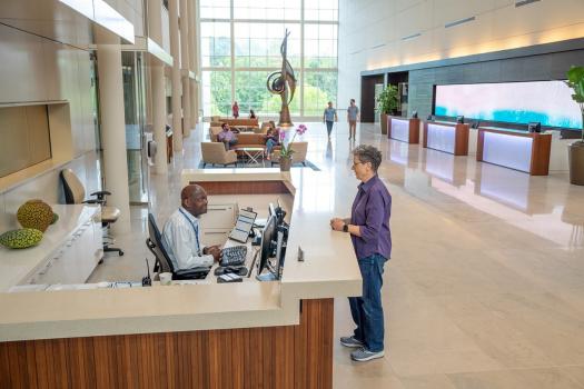 Employees at SAS Building C reception desk