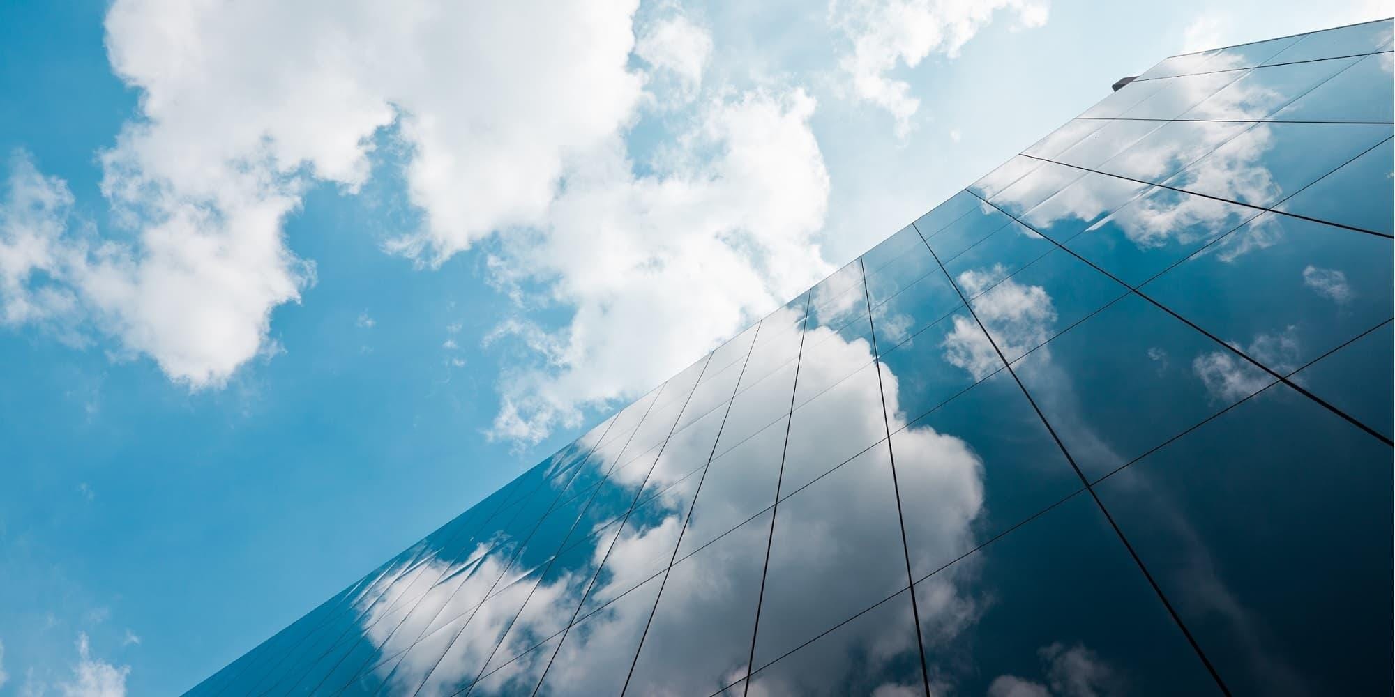 Clouds reflected on commercial building windows