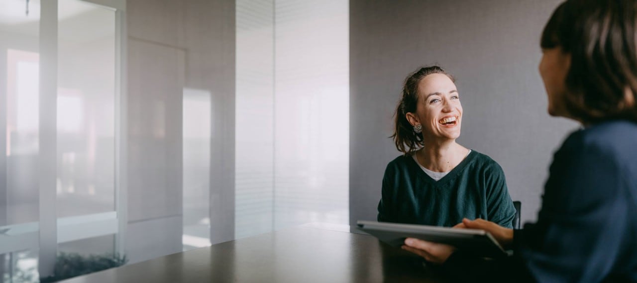 Cheerful woman smiling during consultation