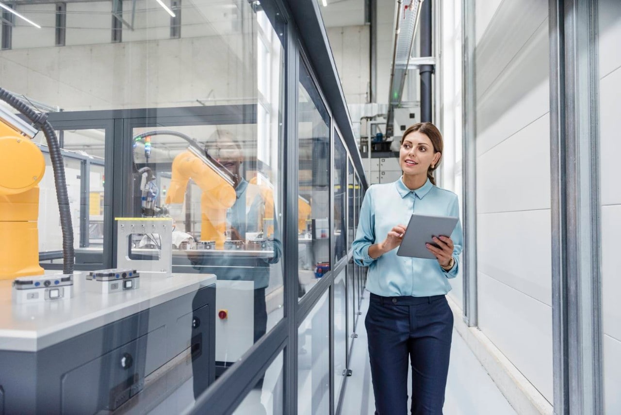 Woman in factory using tablet