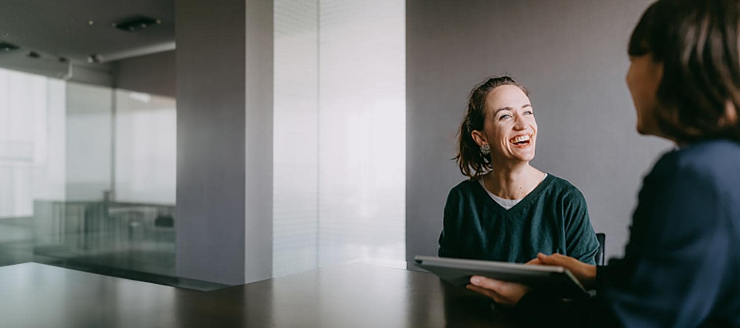 Cheerful woman smiling during consultation