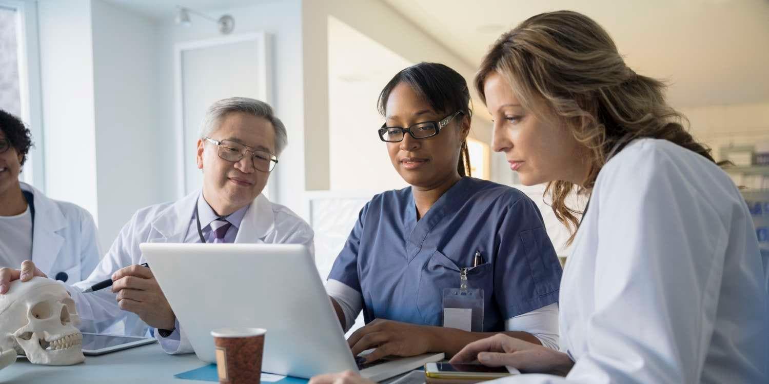 Doctor and nurse looking at tablet together