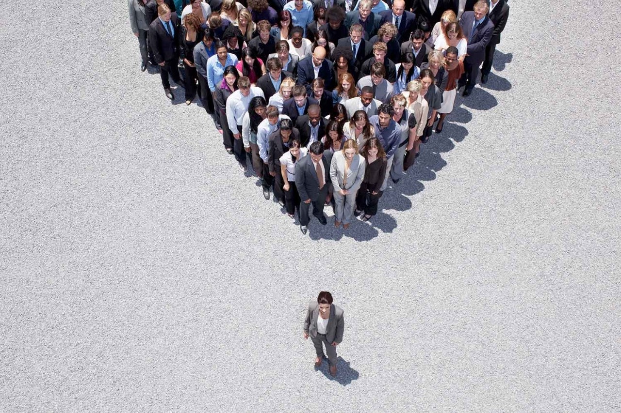 Businesswoman at the front of a crowd