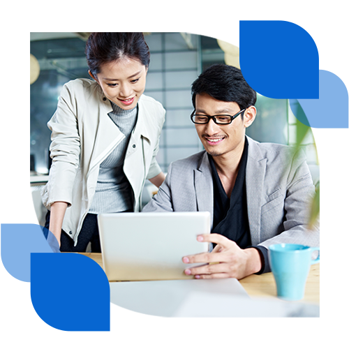 Smiling businesswoman at computer in office