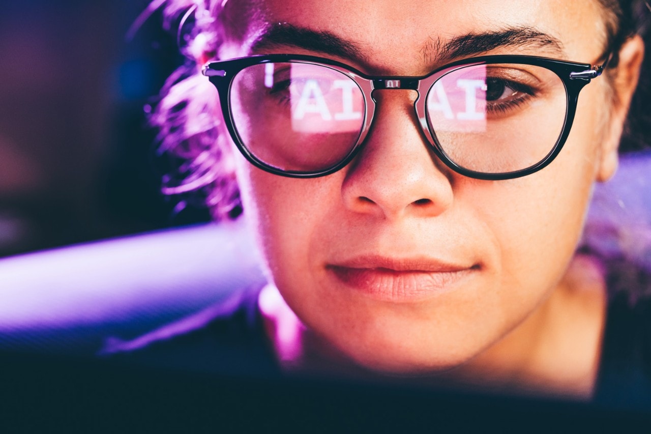 Woman wearing glasses with AI reflection