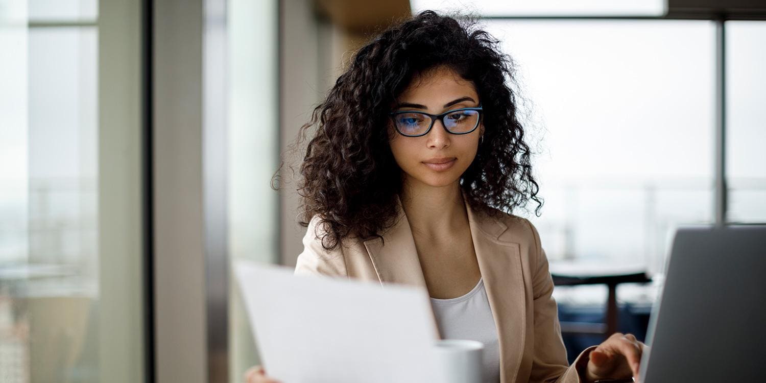 Woman concentrating and looking at computer