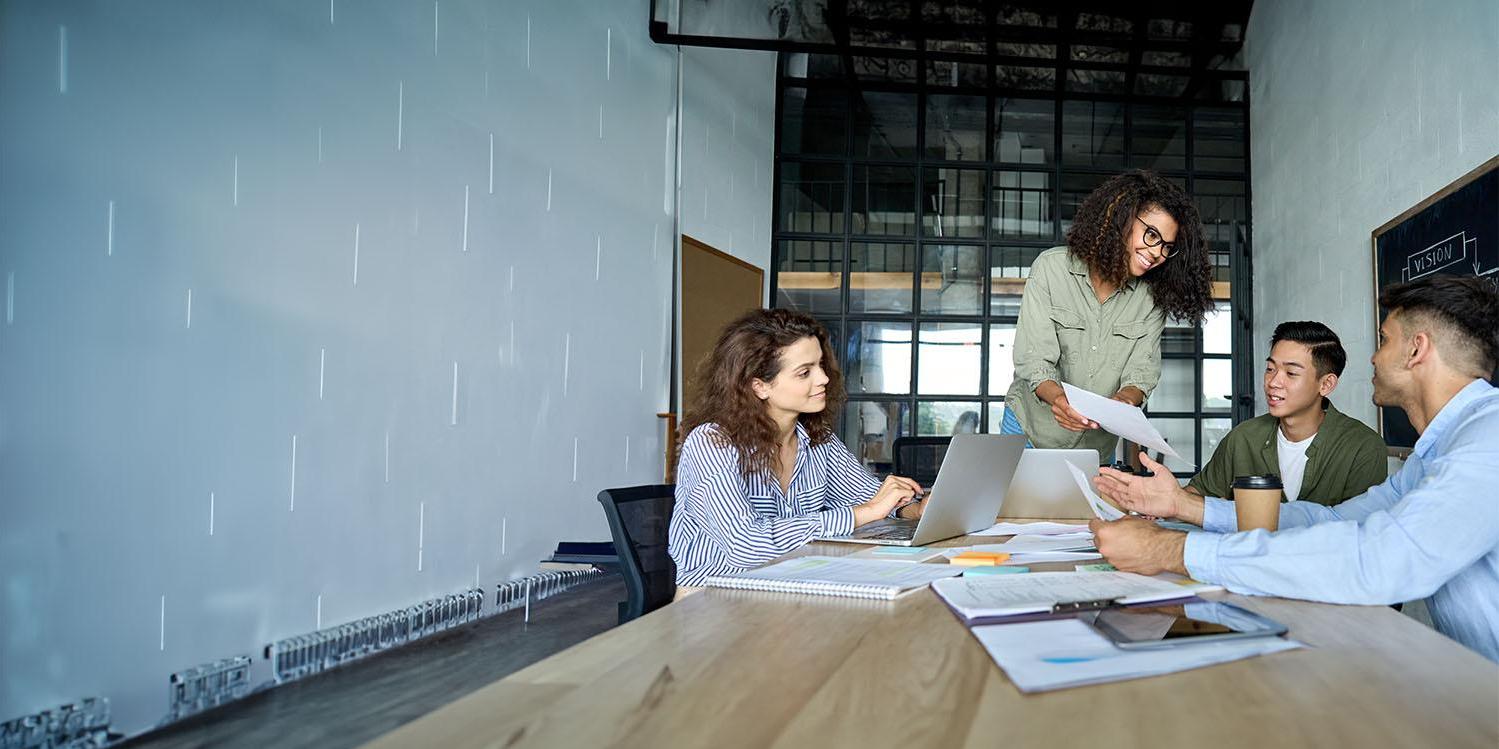 Group of coworkers collaborating in meeting