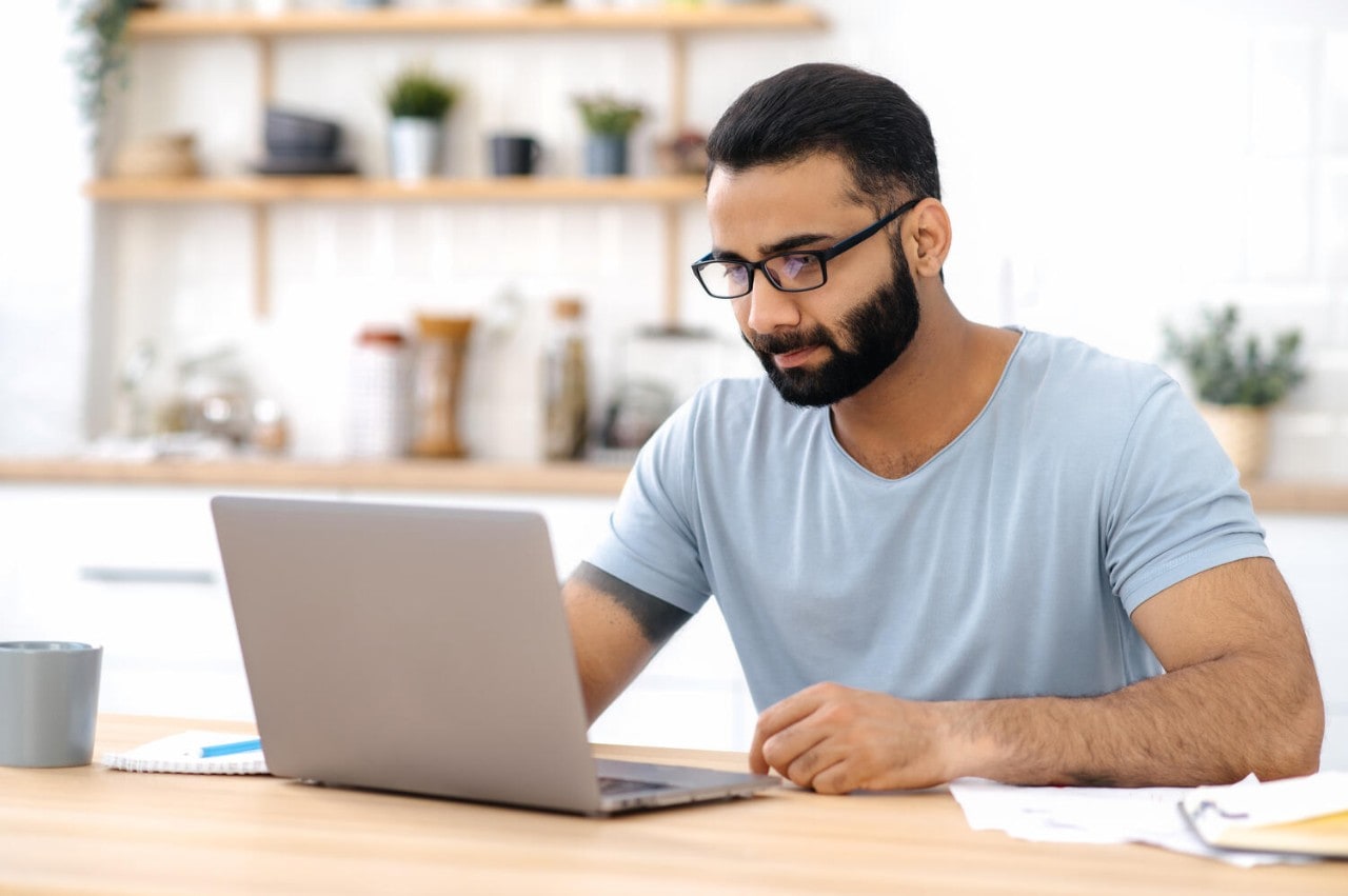 Man typing on a laptop