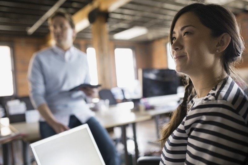 Businesswoman with laptop in meeting