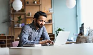 Young businessman working on laptop