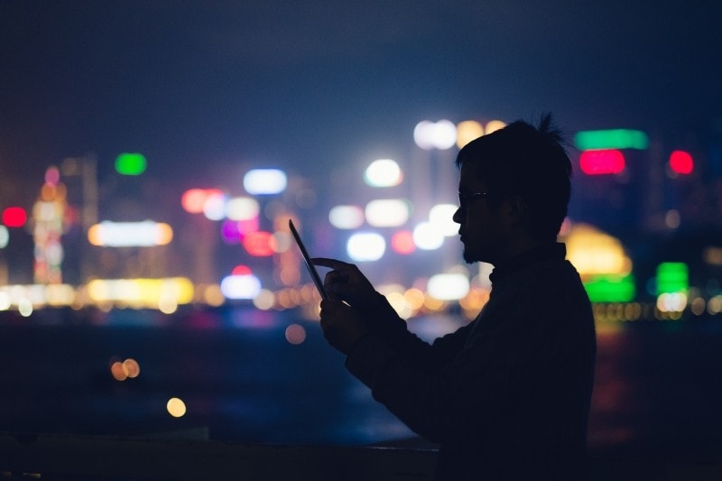 man-with-tablet-at-window