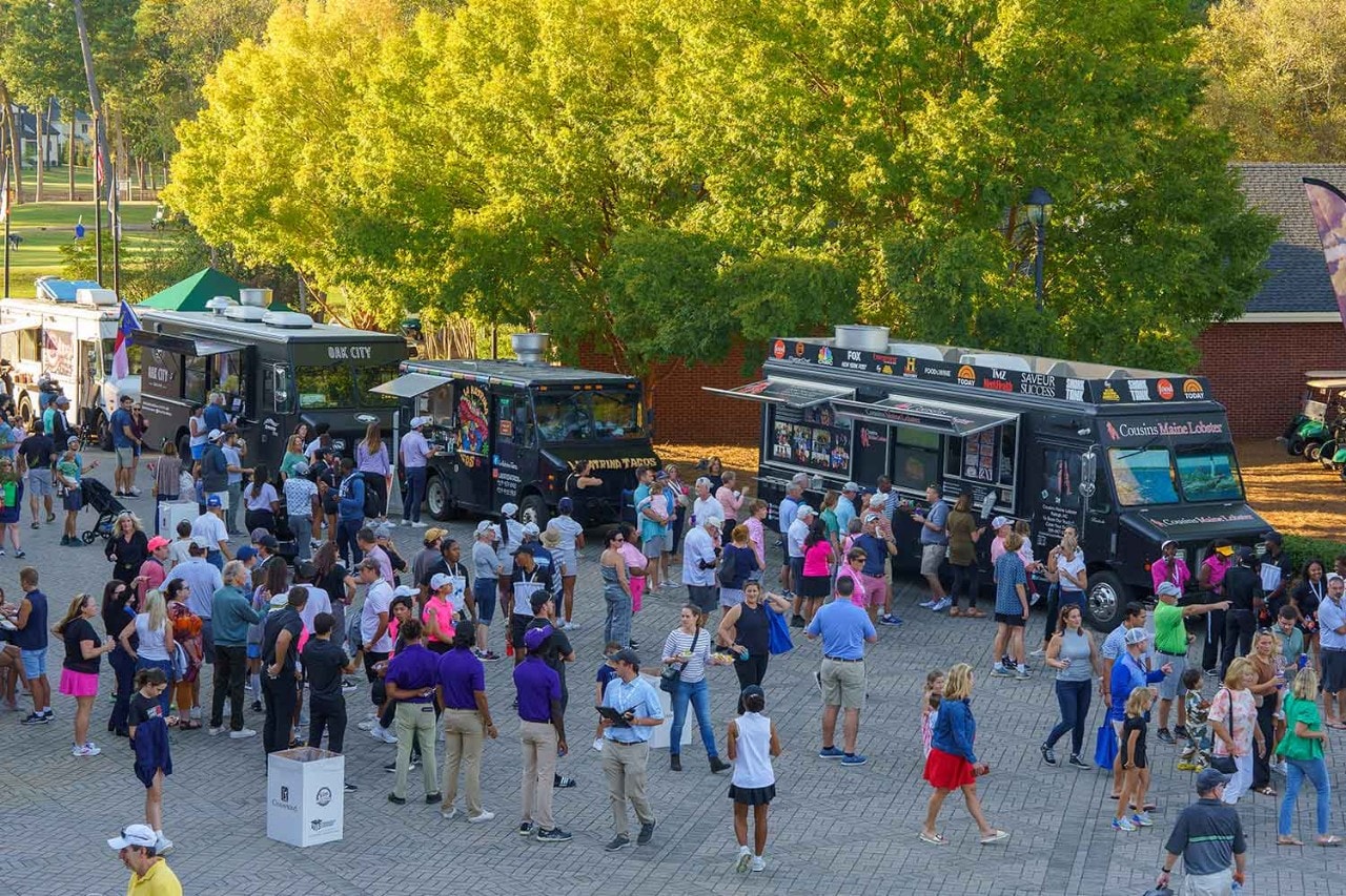 Crowd of people with food trucks